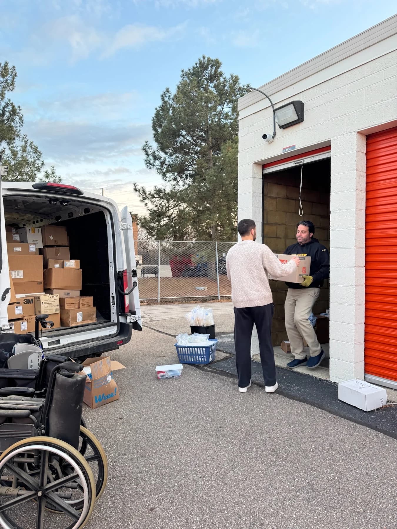 Collecting boxes of donated supplies and medical equipment for redistribution