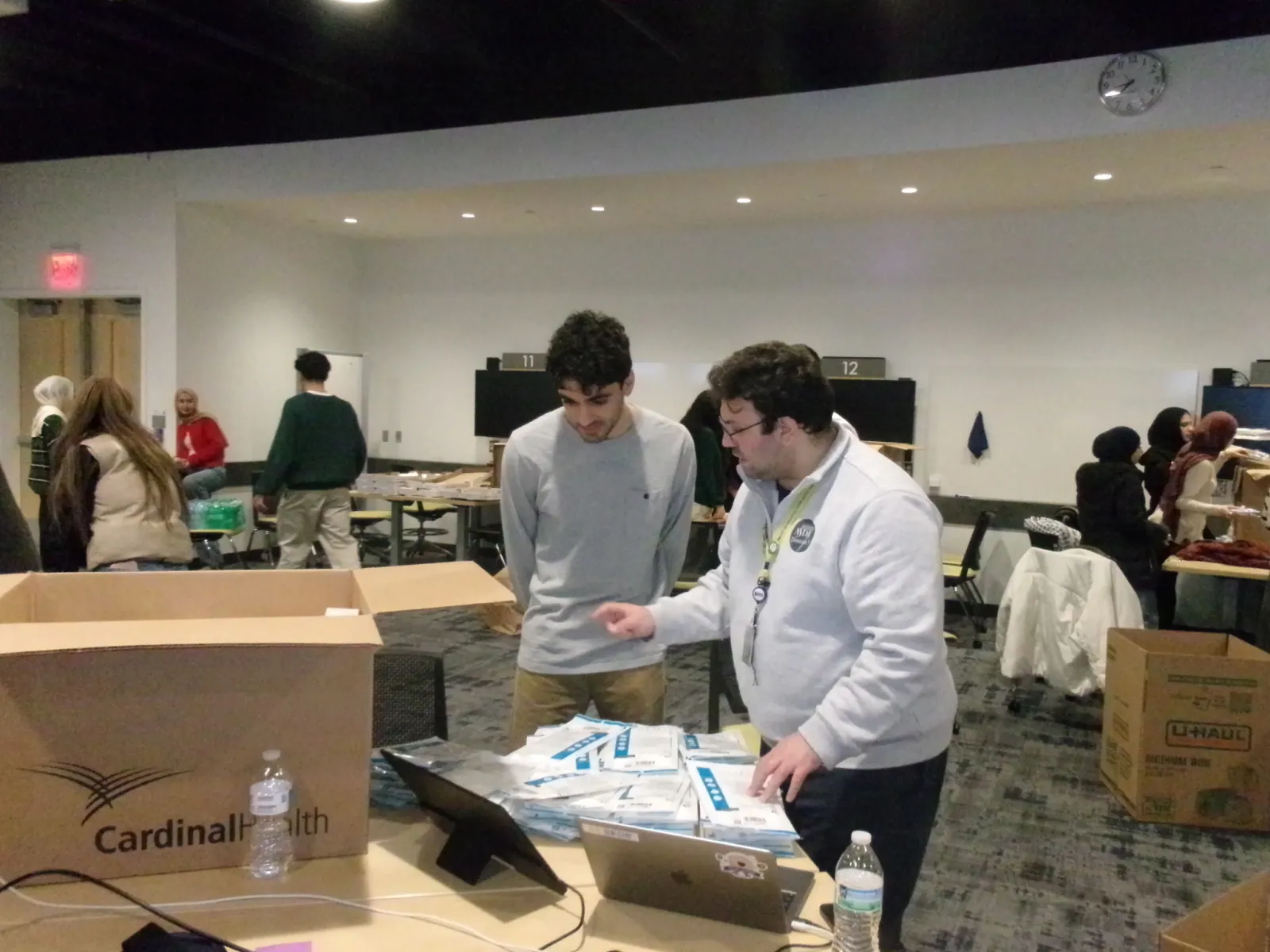 Volunteers reviewing and packing medical supplies at a Project Resurge event