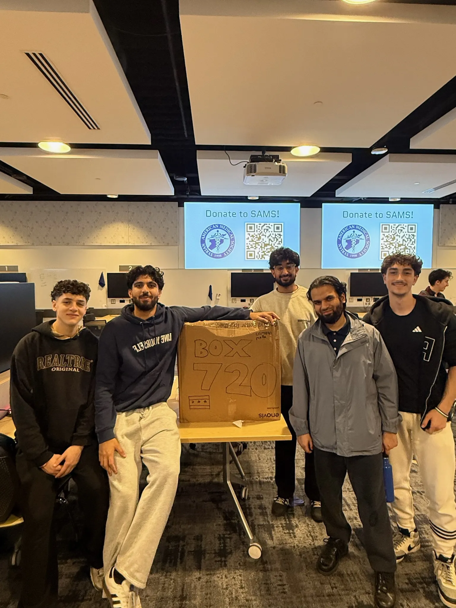 Project Resurge volunteers together at a supply packing event